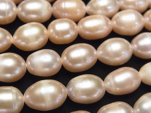 【動画】淡水真珠AA ライス10×7×7mm ピンクオレンジ 1連(約32cm)の画像