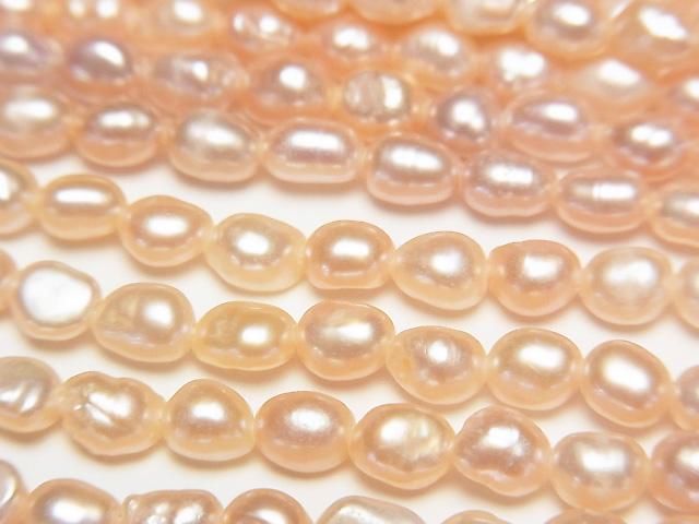 【動画】淡水真珠AA ライス5×3.5×3.5mm 天然オレンジピンク 1連(約33cm)の画像