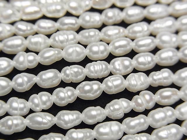 【動画】淡水真珠AA 縞入りライス4×3×3mm ホワイト 1連(約35cm)の画像